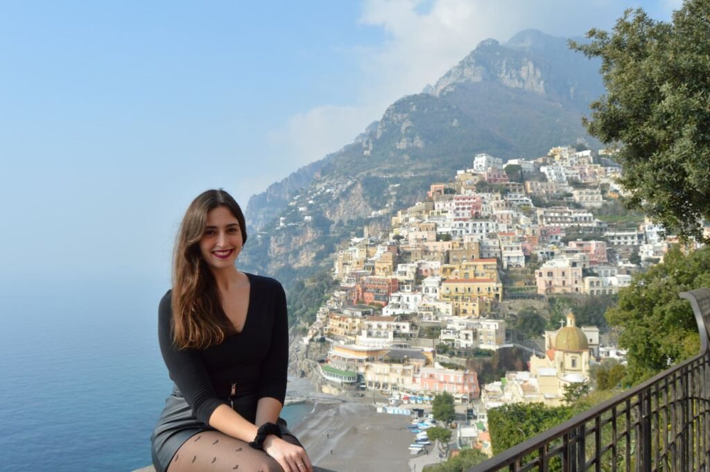 Girl sitting with Positano behind