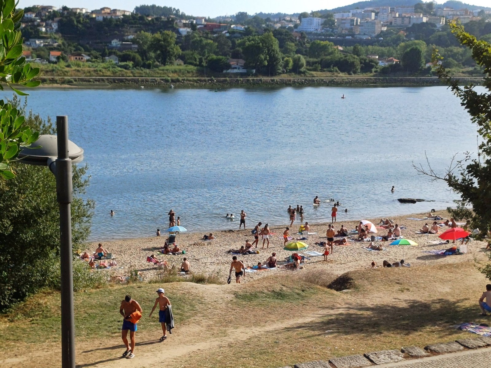 People enjoying Praia Fluvial de Gramido