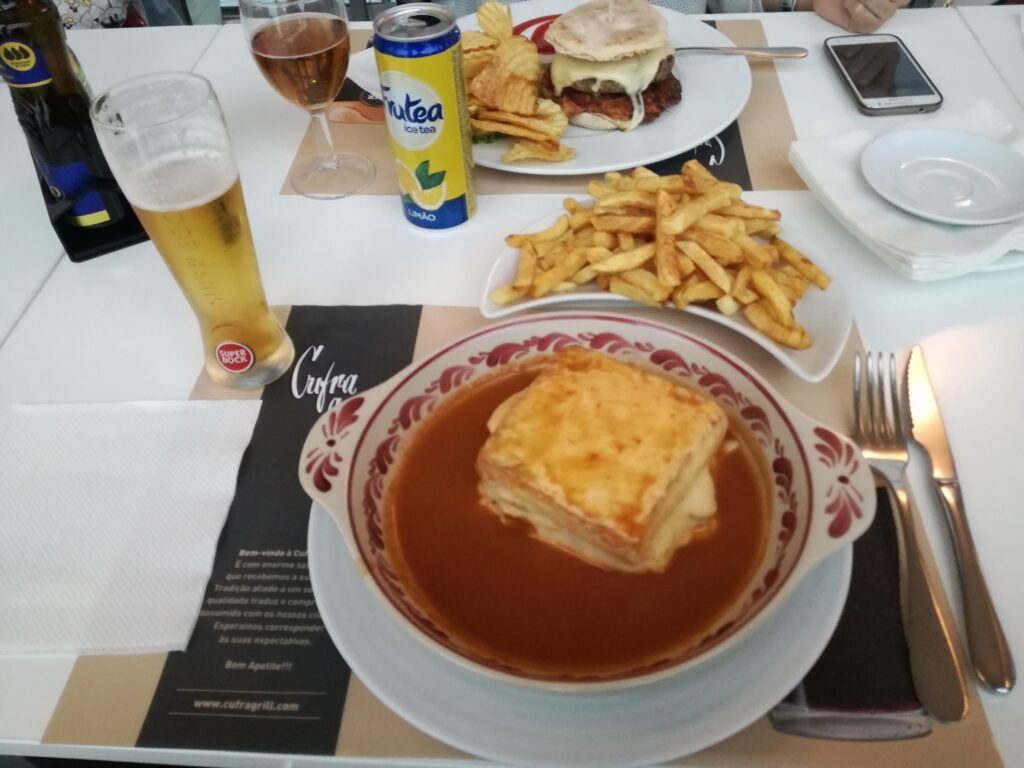 Francesinha from Cufra: a classic Porto sandwich with layers of meat, cheese, and rich sauce.