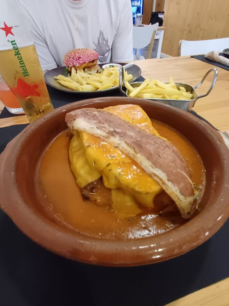 Vegan Francesinha from Padoca Vegan Restaurant: a plant-based twist on the classic Porto sandwich with layers of vegan meat, cheese, and rich sauce